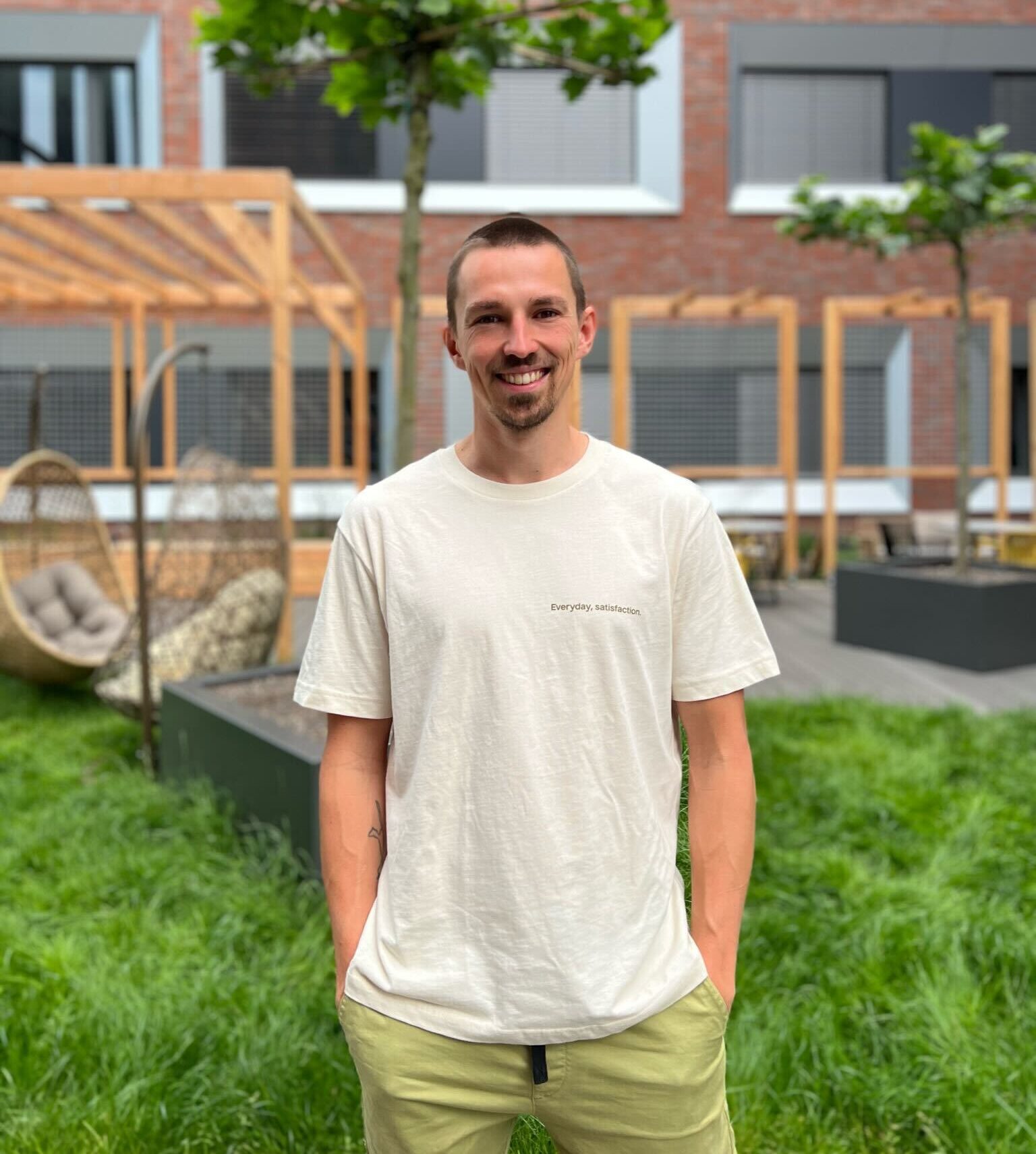 POHA House Münster resident smiling in the garden