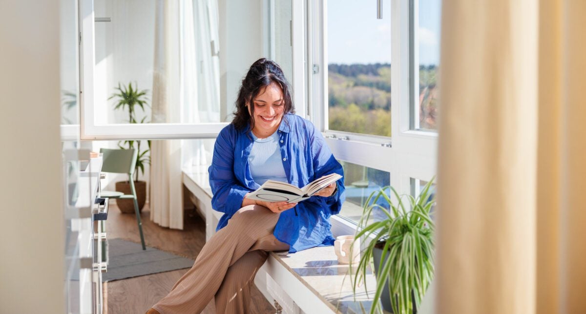 girl reading by the window