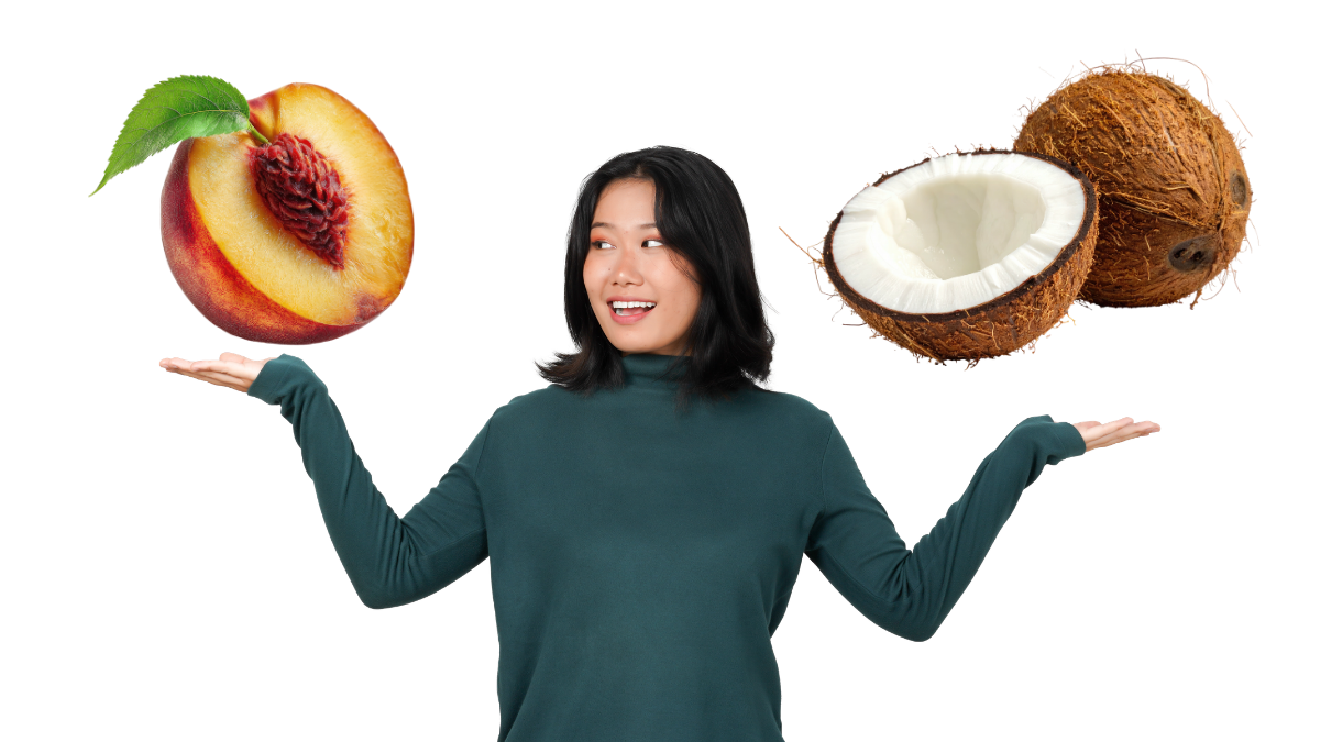 Alt Text: A woman in a dark green turtleneck stands against a solid white background, holding her arms out to her sides with palms facing upward. She is looking toward her right hand, where a large, sliced peach with a green leaf is superimposed. On her left hand, a large coconut and a coconut half are superimposed. The image has a playful, "this or that" comparison style.