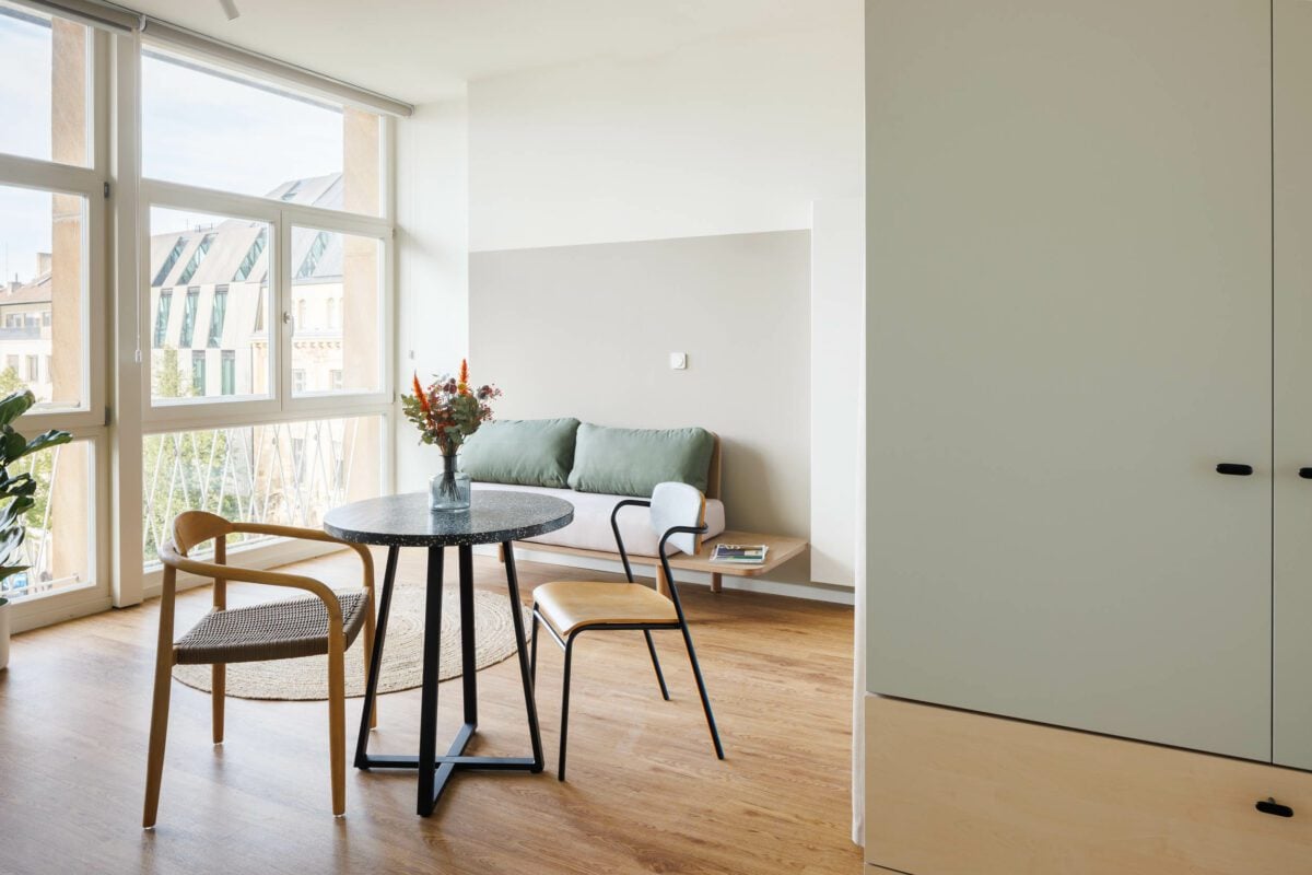 modern furnished studio apartment with big windows